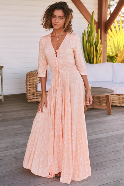 JAASE - Indiana Maxi Dress: Lace Back Shirred Waist A Line Dress with Handkerchief Hemline in Peach Island Print