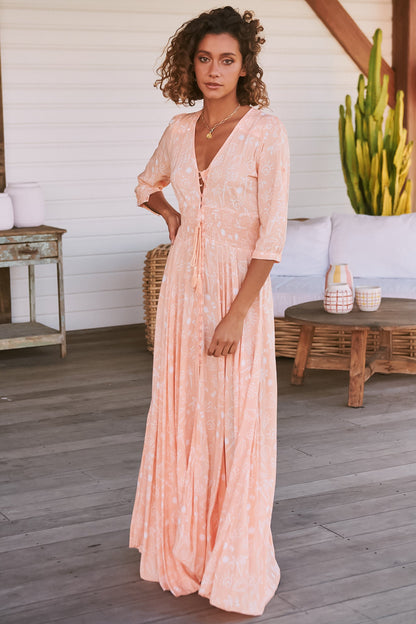 JAASE - Indiana Maxi Dress: Lace Back Shirred Waist A Line Dress with Handkerchief Hemline in Peach Island Print